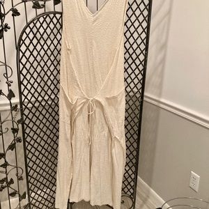 FP beach. Cream color jumpsuit wide leg tie front. Runs large. Great for summer